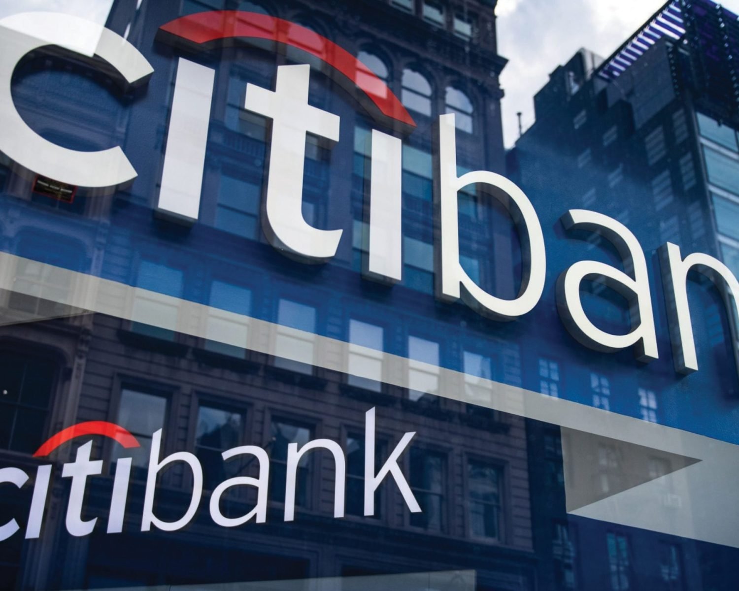 Signage is displayed in the window of a Citigroup Inc. bank branch in New York, U.S., on Wednesday, July 3, 2019. Citigroup Inc. is scheduled to release earnings figures on July 15. Photographer: Mark Kauzlarich/Bloomberg